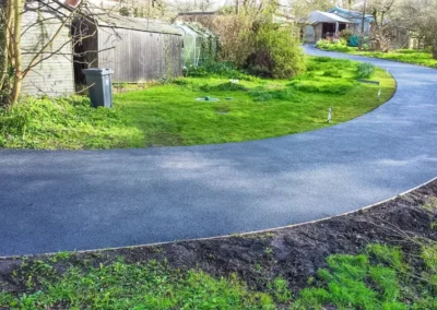 Axminster Removed old damaged edging kerbs